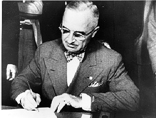 President Truman signing 1950 Amendments